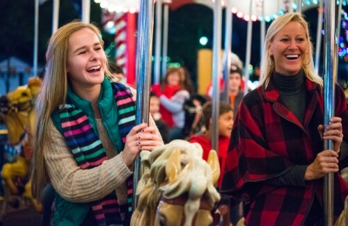 Mother and daughter riding carousel together at Hersheypark Christmas Candylane