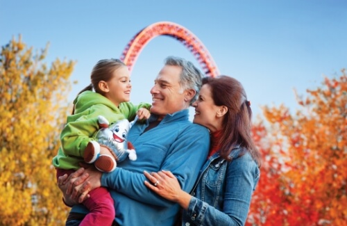 Child and family in front of Fahrenheit roller coaster at Hersheypark