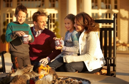 Family enjoying hot chocolate together at The Hotel Hershey