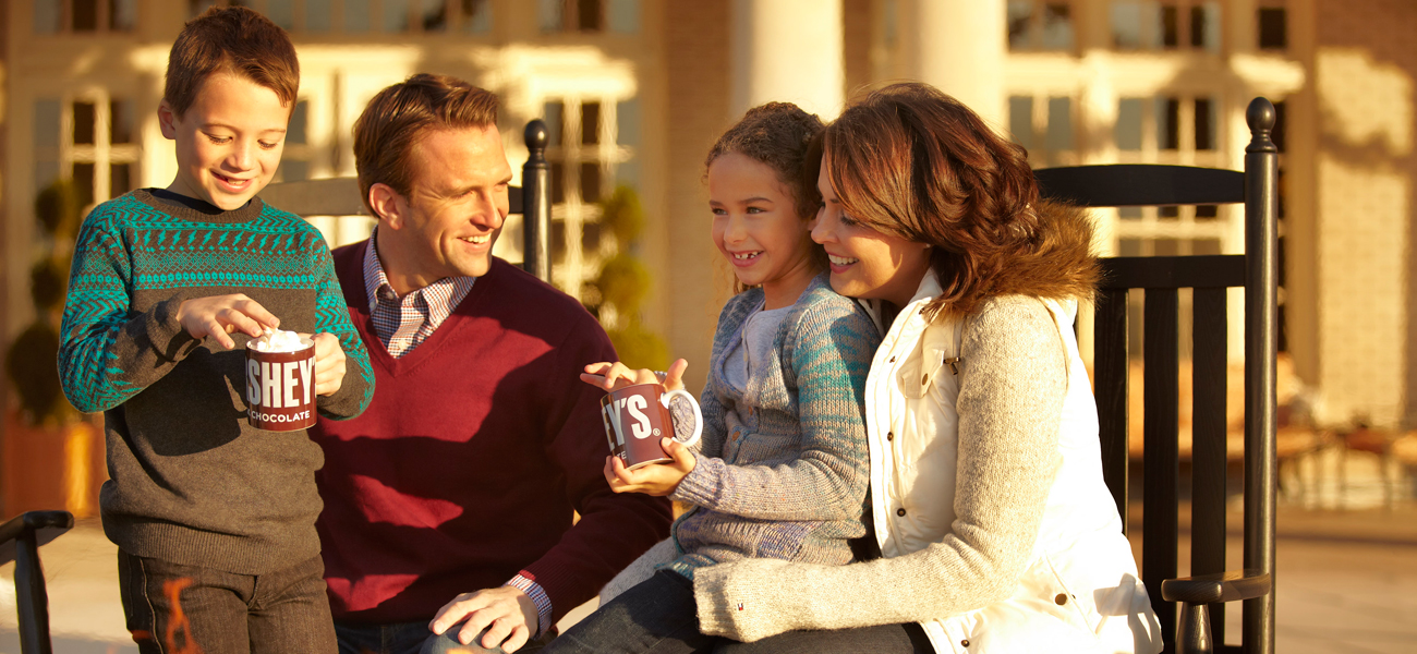 family around a fire on the veranda