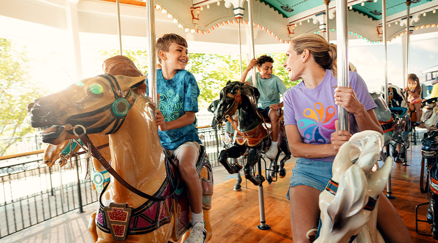 Family riding a carousel at Hersheypark