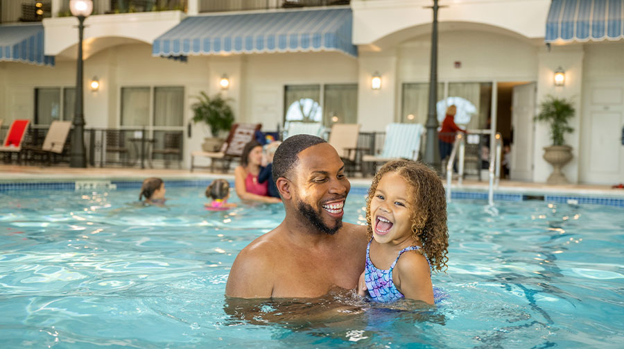 Father and daughter at the pool in The Hotel Hershey.