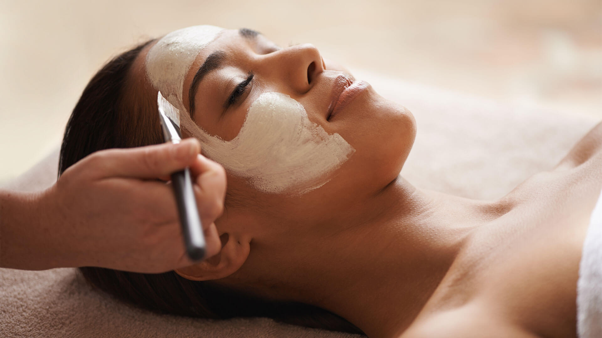 Woman at spa getting facial